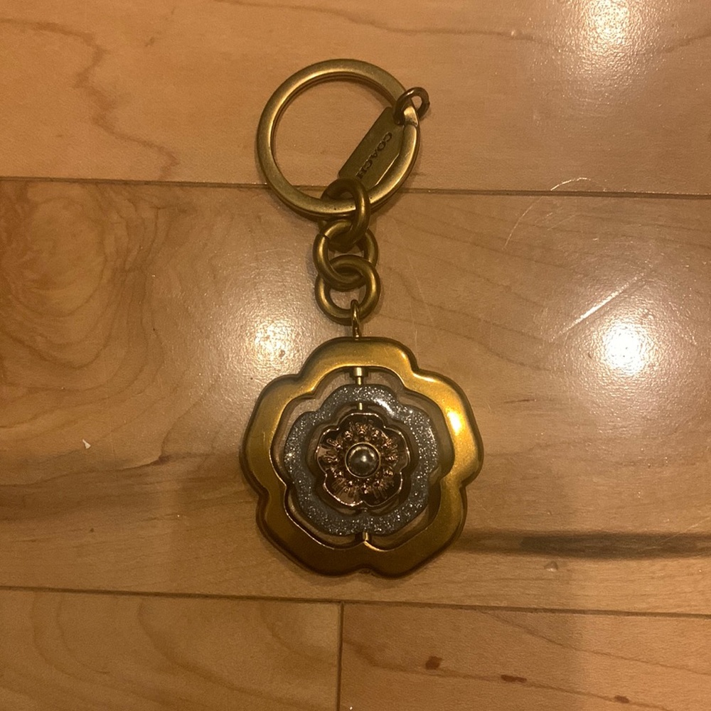 Coach gold and blue flower bag charm